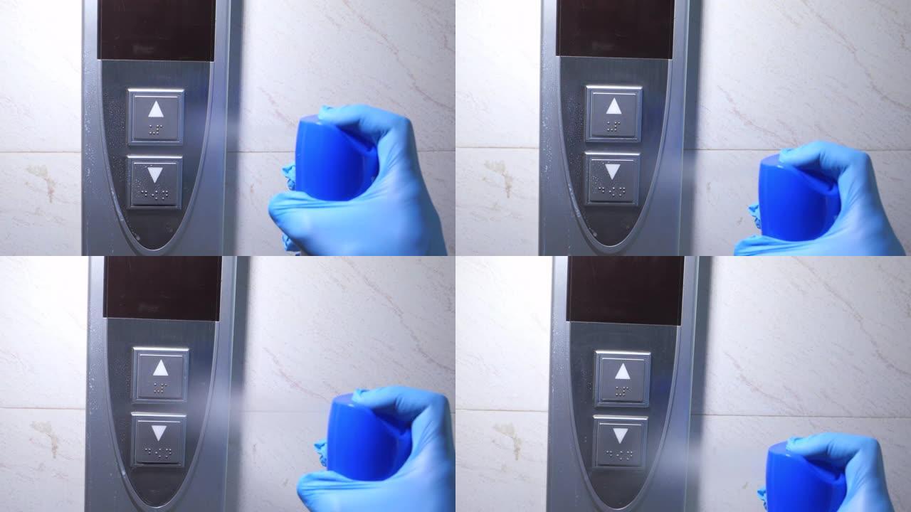 男子戴上防护手套消毒电梯按钮。