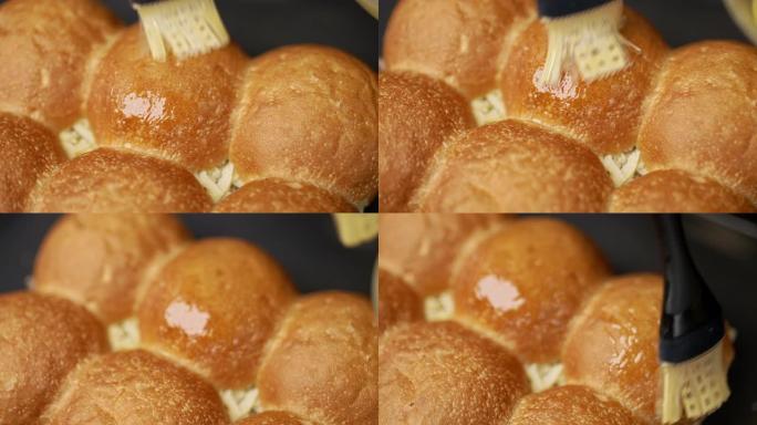 慢动作用糕点硅胶刷黄油/刷面包卷。概念用4K硅胶刷润滑面包。
