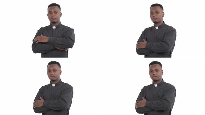 自信的黑人牧师的肖像，双臂交叉，点头站在半圈，孤立在白色背景上