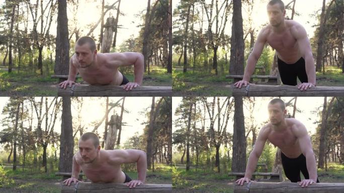 英俊的白人男子俯卧撑户外锻炼交叉训练晨抽三头肌手臂锻炼运动场