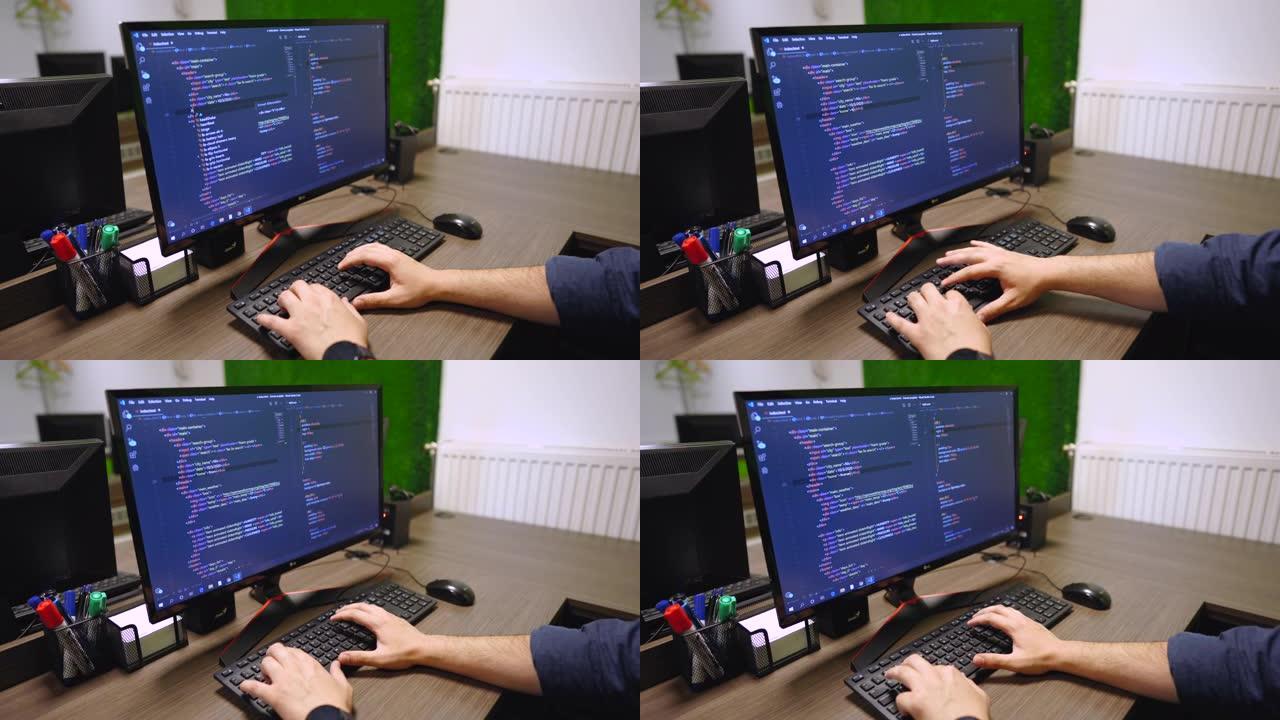 年轻人在电脑上编码。
