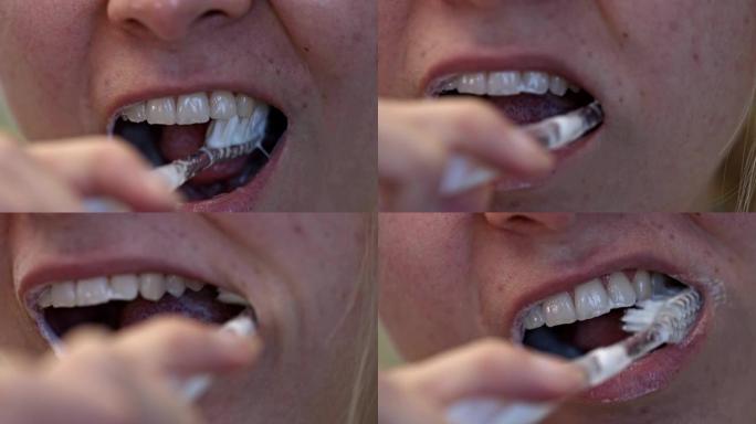 清洁牙齿时近距离观察女人的嘴和牙齿。