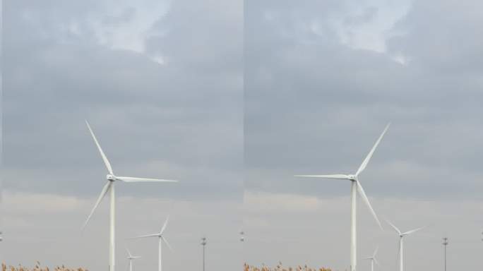 风力发电机竖拍构图。清洁能源和碳中和概念
