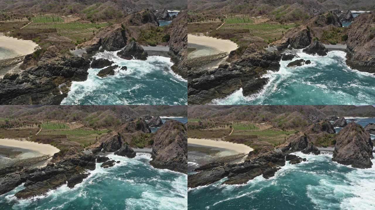 龙目岛的海水被大岩石和山脉环绕