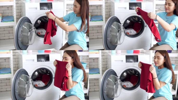女人在家用洗衣机洗衣服