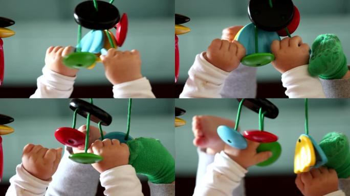 婴儿手握玩具，特写婴儿玩儿童发展玩具