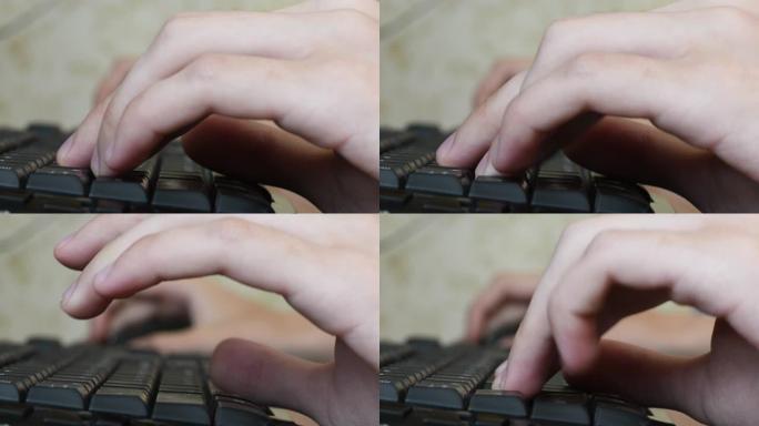 青少年的手在玩网络游戏时快速按下电脑键盘按钮