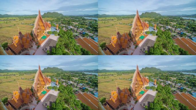 泰国北碧府虎洞寺或Wat Tham Suea的大金佛像和宝塔的时间流逝。旅行概念中的著名旅游景点地标