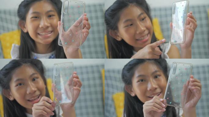 亚洲女孩自己画手机套，在家DIY。