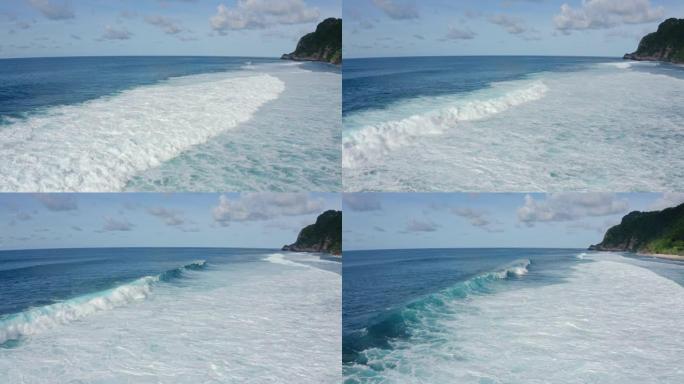 鸟瞰海洋，美丽的泡沫滚滚海浪，海滩上的山