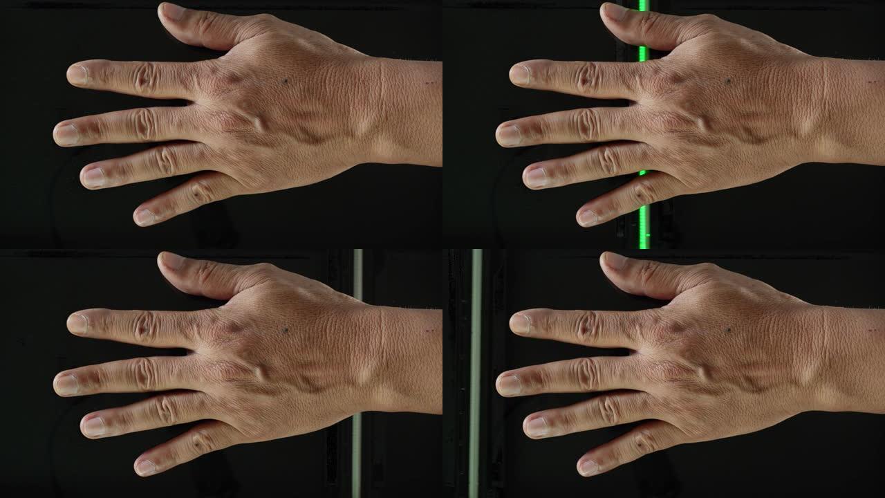 人类将左手放在扫描仪上，并通过手印分析生物特征数据。