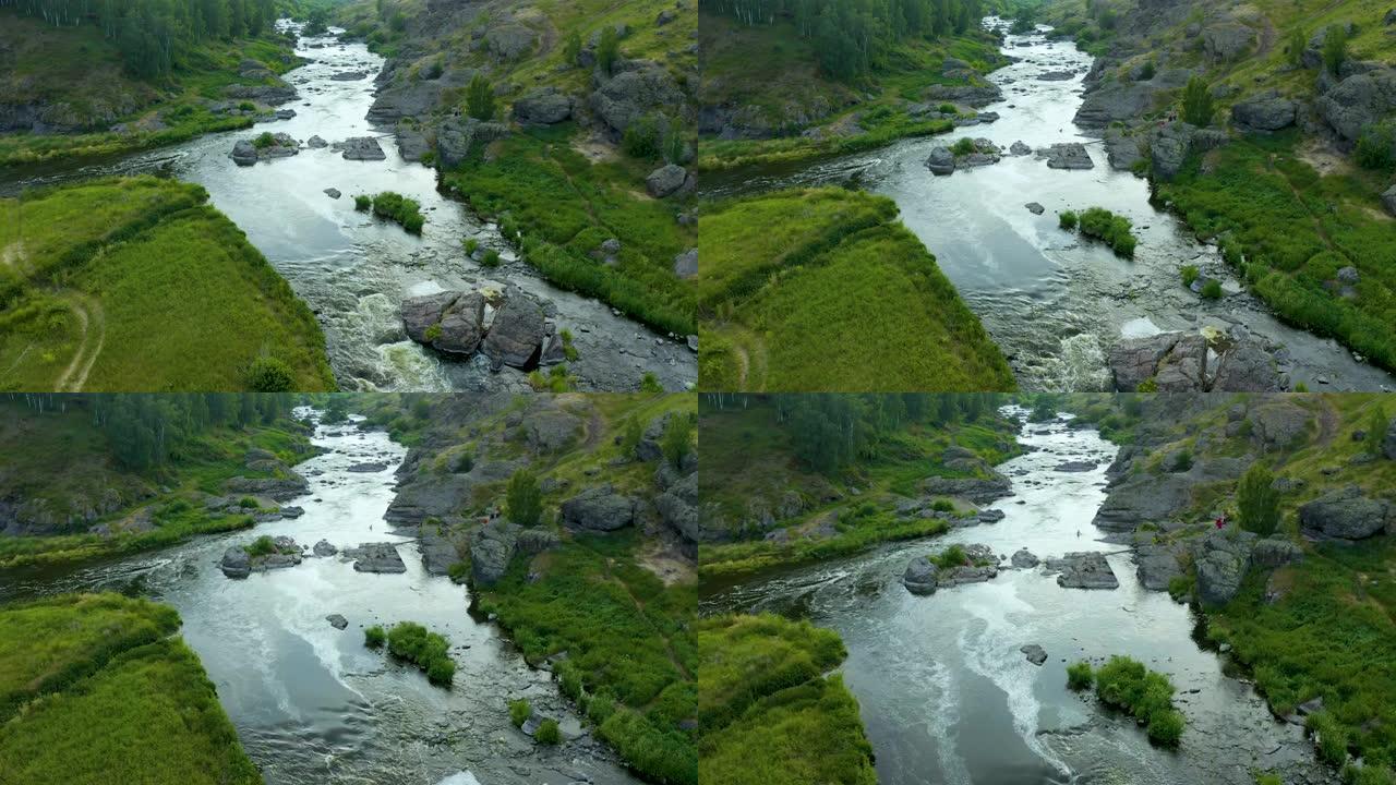 乘坐无人驾驶飞机飞越一个晚上风景如画的山谷，那里有暴风雨的溪流和伊塞特河的急流，是旅游胜地。俄罗斯乌
