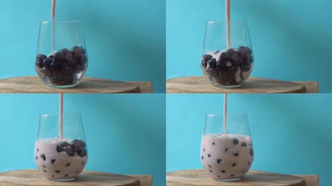 在玻璃杯中放入新鲜蓝莓的酸奶特写镜头。健康的早餐