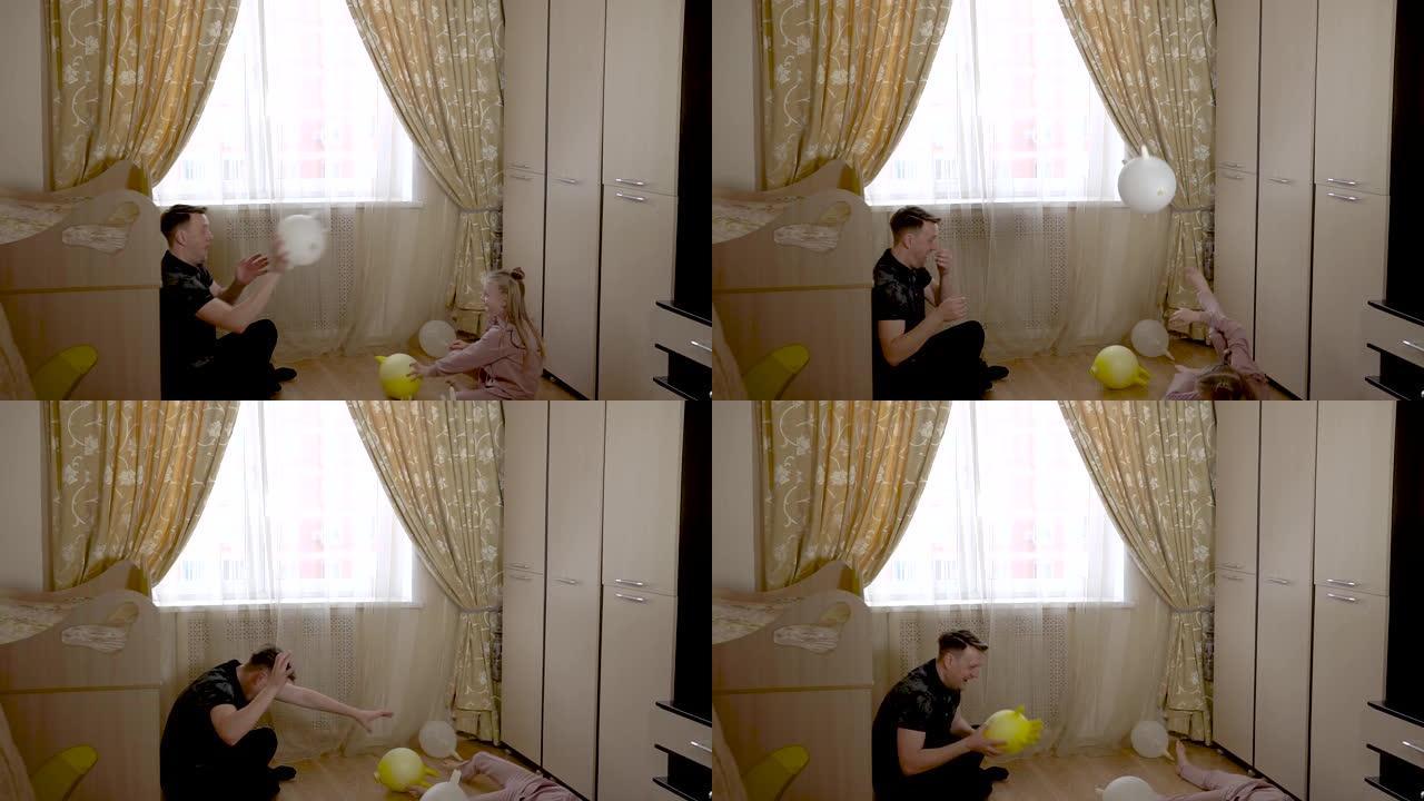 快乐爸爸玩气球手套和一个开朗的女孩打火机在一个大客厅穿着时髦的衣服。靠着婴儿床和沙发。