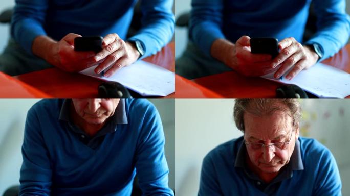老人使用智能手机设备发短信。检查手机的高级工人