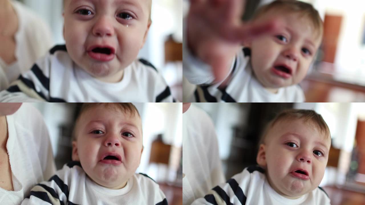 心烦意乱的婴儿蹒跚学步。泪流满面的婴儿男孩哭泣