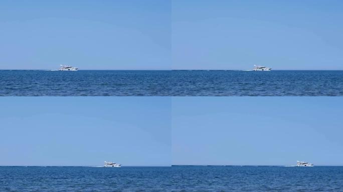 白色游艇在晴朗的晴天在海上航行，侧视图。