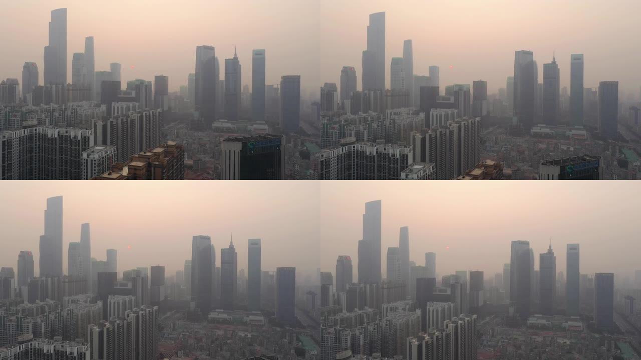 日落时飞行在广州市中心市区空中全景4k中国