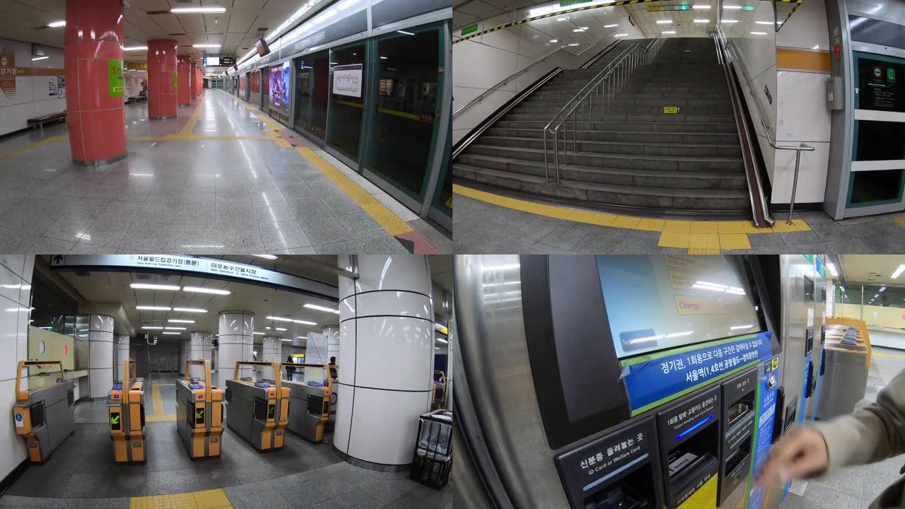 10月21日，在韩国首尔，人们走出地铁站买票。前视图散步。