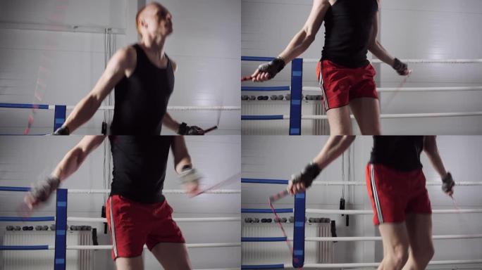 斗士男子在拳击圈跳绳上跳跃。健身房跳绳运动运动员训练。有氧变暖，积极的男性生活方式。
