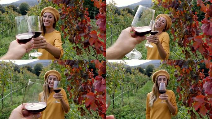 慢动作: 年轻夫妇在秋天的葡萄园里品尝葡萄酒