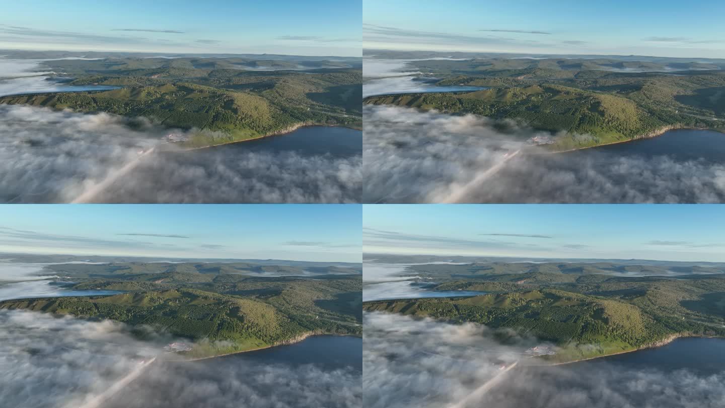航拍晨雾缭绕的绿色山谷湖泊