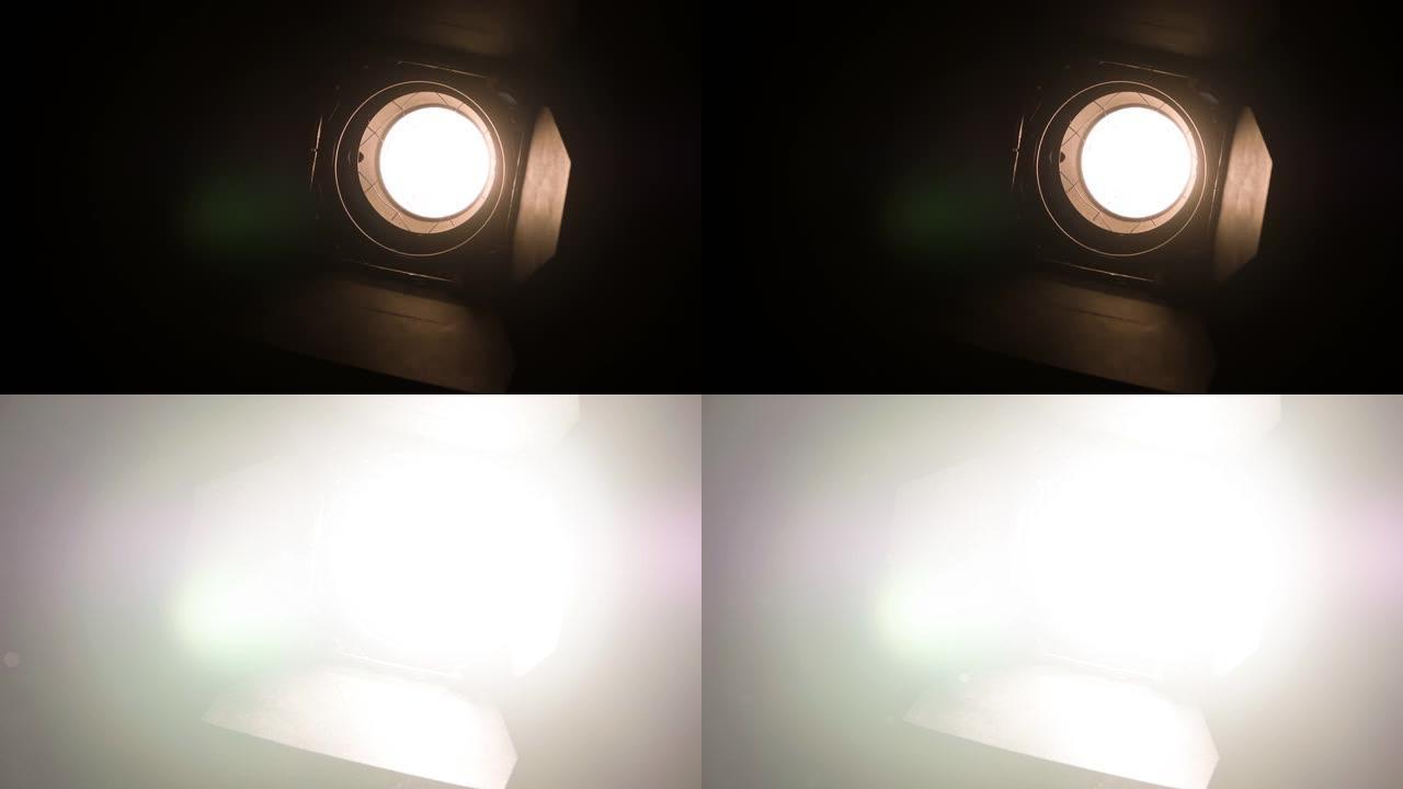 电影工作室的聚光灯变得越来越亮，直到屏幕变白