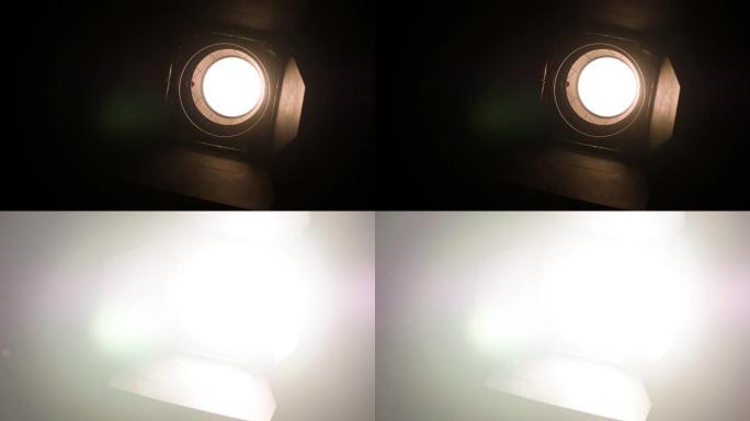 电影工作室的聚光灯变得越来越亮，直到屏幕变白