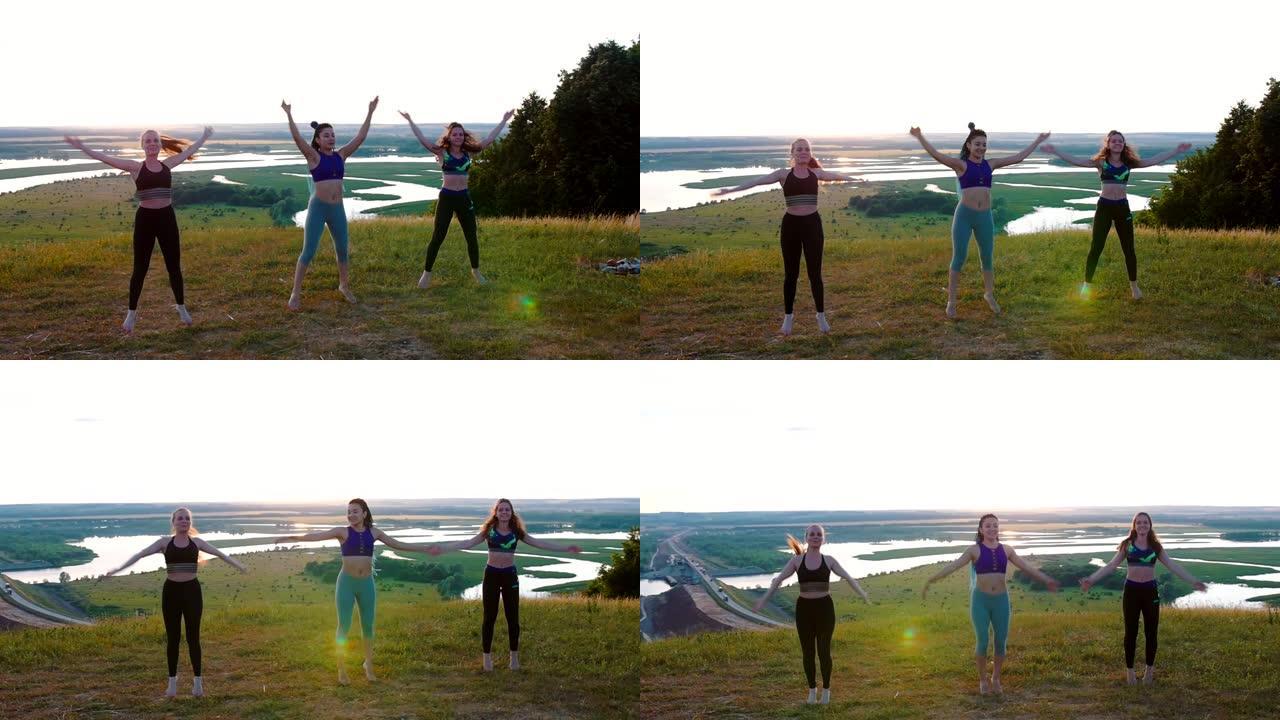 自然健身-三个年轻女子在新鲜空气中做运动-现场跳跃