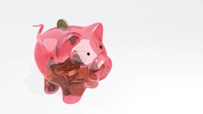 硬币落入粉红色的玻璃存钱罐-财富，节俭和有效的投资计划和业务的象征。金融成功的象征。现金储蓄。