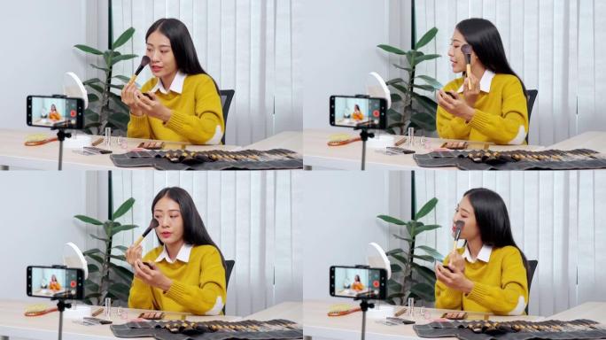 4k视频片段的年轻亚洲女性博客录制vlog视频教程和评论推广产品与化妆化妆品在社交媒体直播