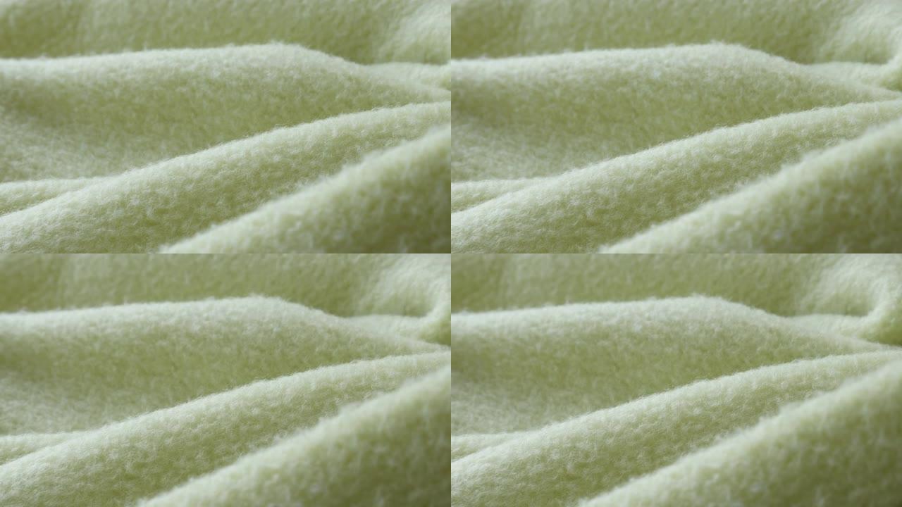 绿色摇粒绒毛毯4k平底锅的精细表面