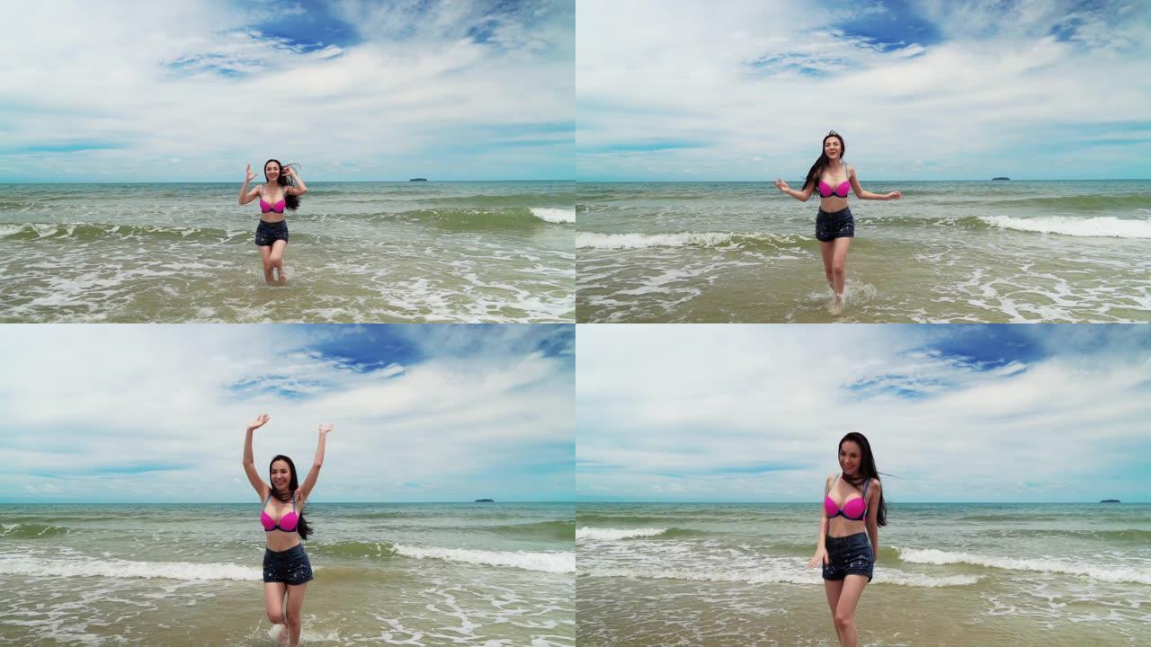 女人在海里跑来跑去，她在夏天的主题氛围中开朗有趣。