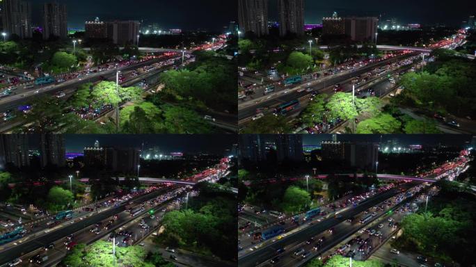 雅加达市中心夜间照明交通街路口航空全景4k印度尼西亚