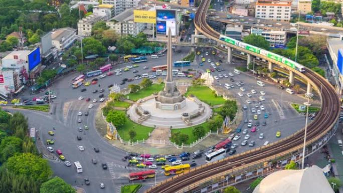 繁忙街道路上胜利纪念碑鸟瞰图的时间流逝。曼谷市中心天际线的环形交叉路口。泰国。智慧城市金融区中心。日