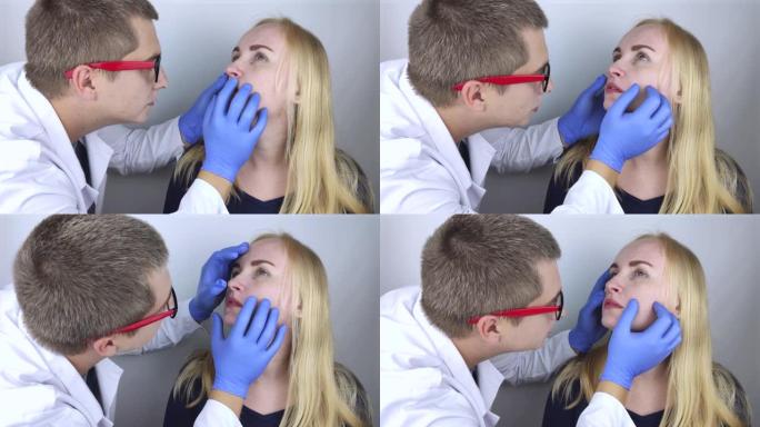 耳鼻喉科医生检查女孩的鼻腔。鼻子，息肉，腺样体和呼吸急促的疼痛感觉。鼻子软骨组织的骨折。鼻咽管的闭合