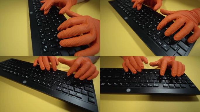 戴着手套在桌子上键盘上打字的人周围运动