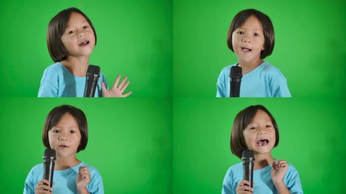 快乐的亚洲儿童在绿色背景上唱歌。