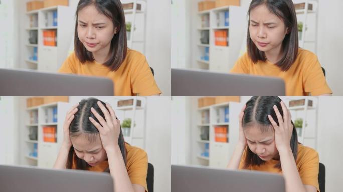 亚洲商务女性因辛勤工作和在办公桌办公室长时间使用计算机而感到头痛。