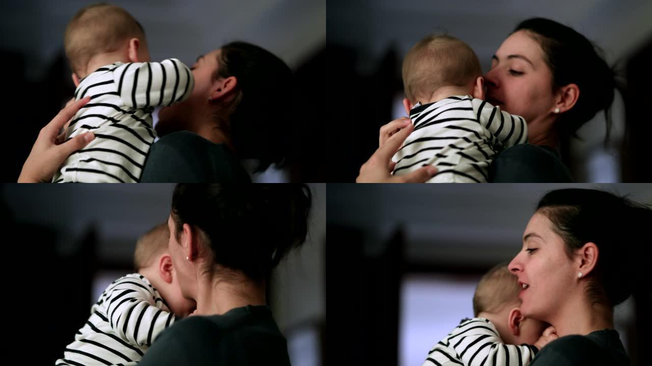 休闲妈妈亲吻婴儿。现实生活中真实的爱心父母和婴儿关系