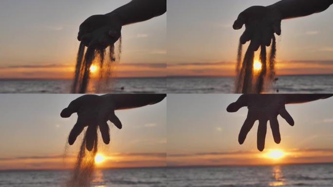 日落时分，沙子落在女人的手指之间。生命的时间和短暂