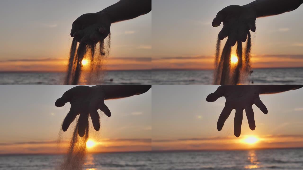 日落时分，沙子落在女人的手指之间。生命的时间和短暂
