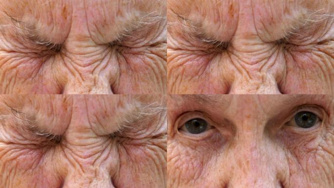 成熟女人的肖像强烈地拧起她的灰色眼睛，然后睁开。年迈的祖母皱着皱纹的脸看着镜头，表情惊讶。慢动作
