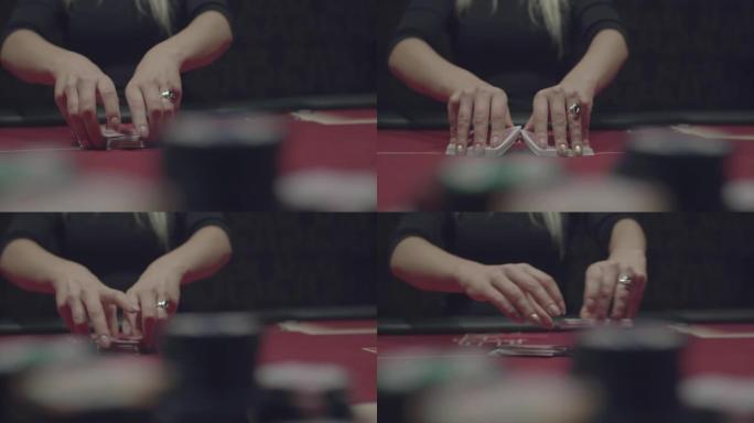在镜头前的比赛中，女庄家的手巧妙地洗牌扑克牌