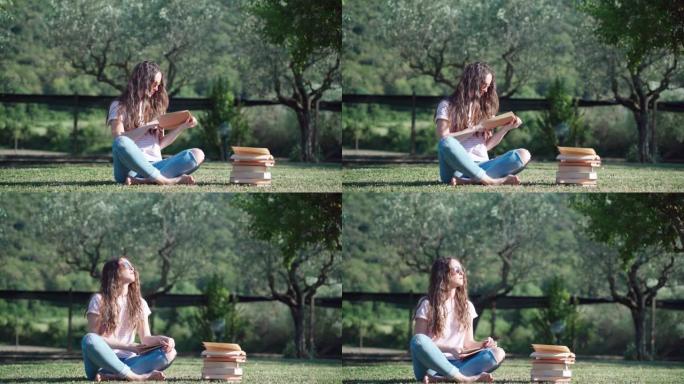 户外休闲，灵感和创意概念。女孩坐在花园里看书，集中女学生在家学习。自我教育理念