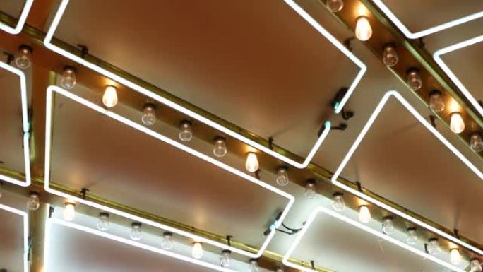 老式的电灯在晚上闪烁和发光。美国拉斯维加斯复古赌场装饰的抽象特写。发光复古风格灯泡在弗里蒙特街上闪闪