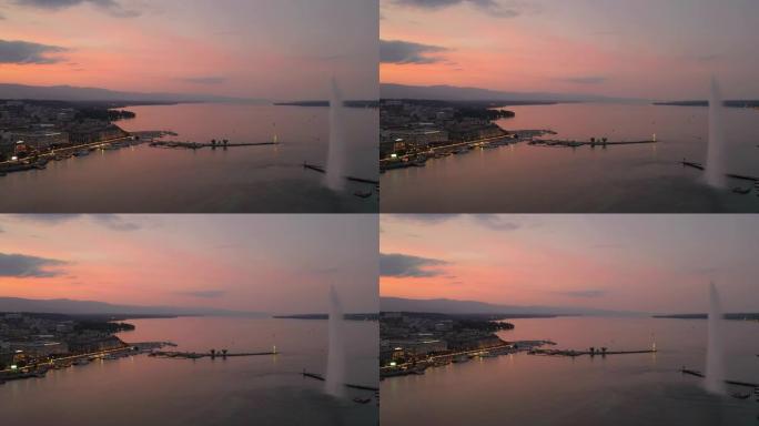 飞越日内瓦市日落天空之夜照明交通湖滨湾空中全景4k瑞士
