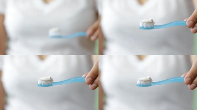 在牙刷上涂抹牙膏