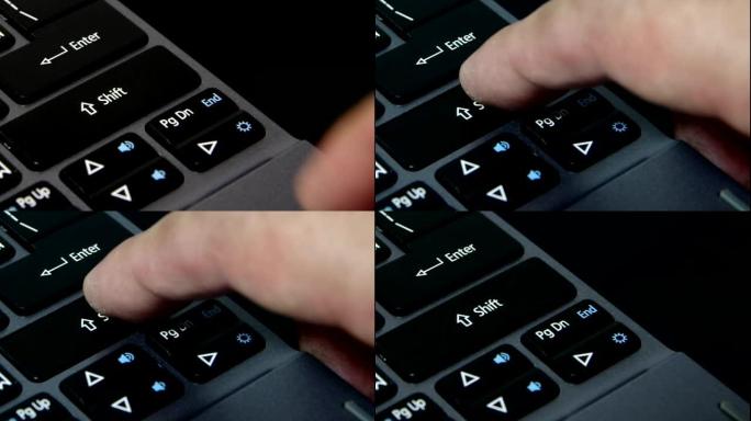 笔记本键盘上的手指按下shift按钮
