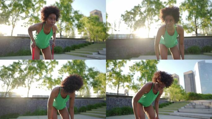 黑人妇女在公园里用阻力带锻炼